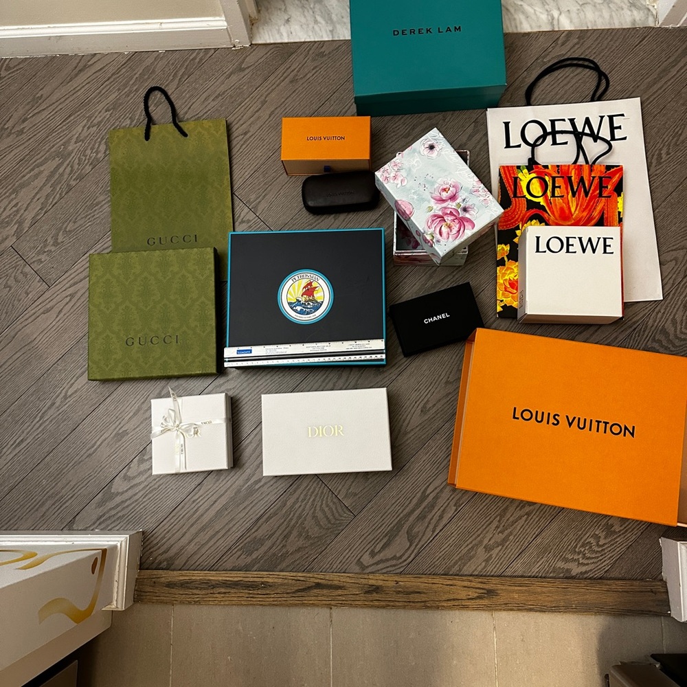 Assorted luxury brand boxes and bags